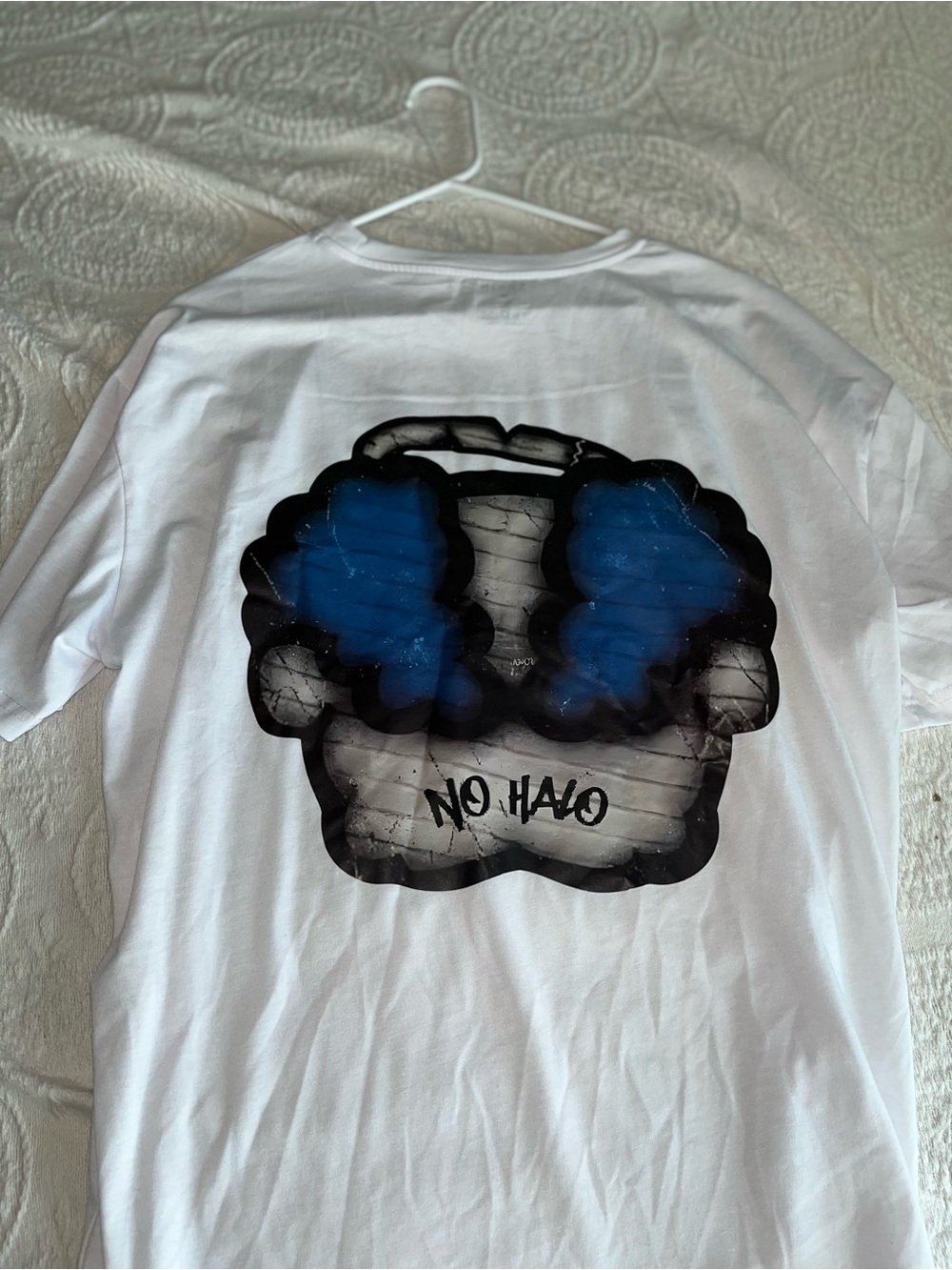 White Graphic Tee with Blue and Black Skull Design